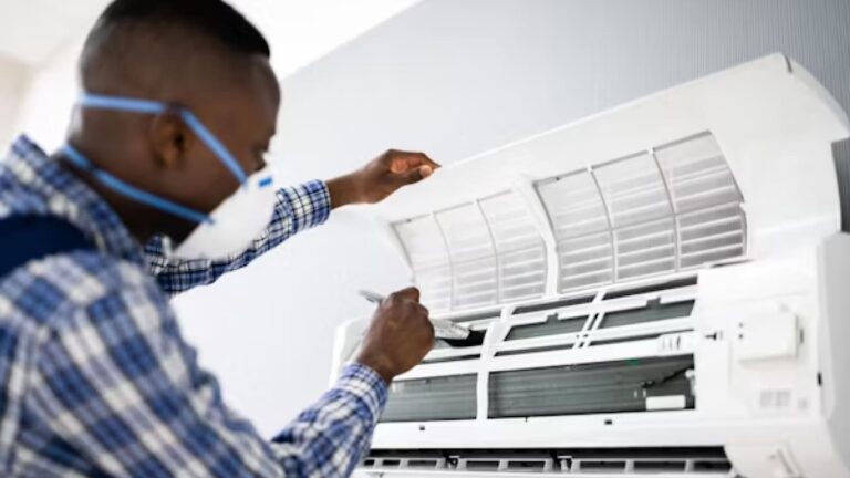 a person clean air conditioning