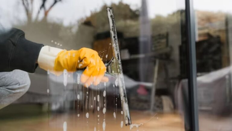 cleaning window inside a store