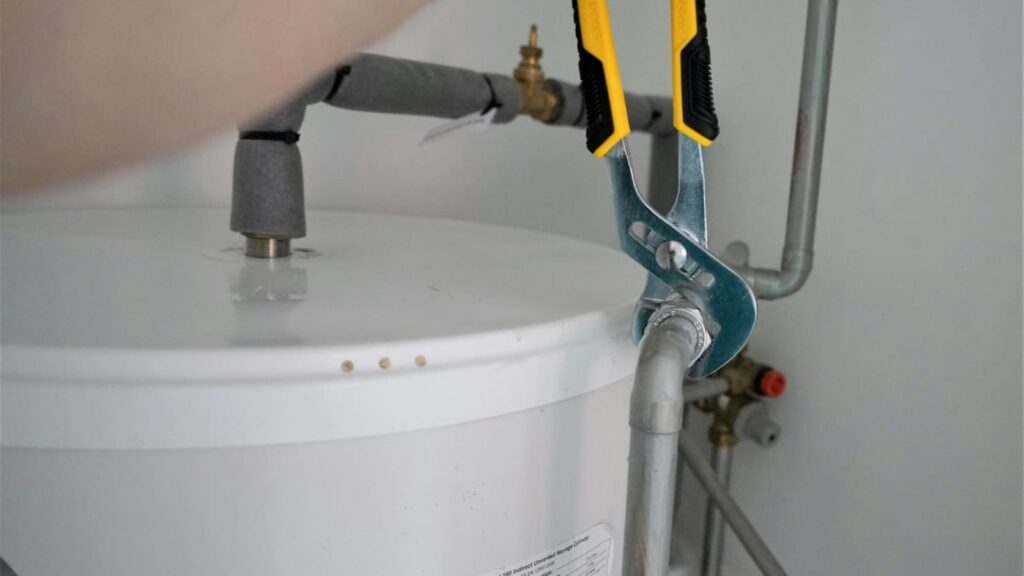 person doing plumbing
