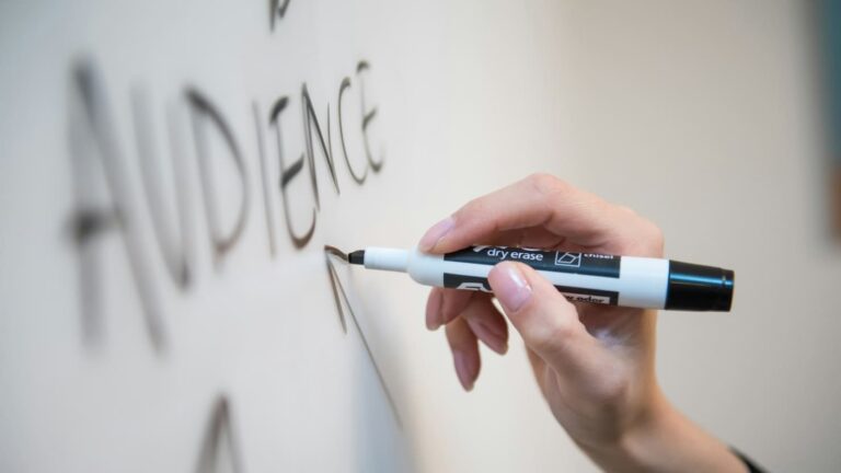 writing "audience" on whiteboard