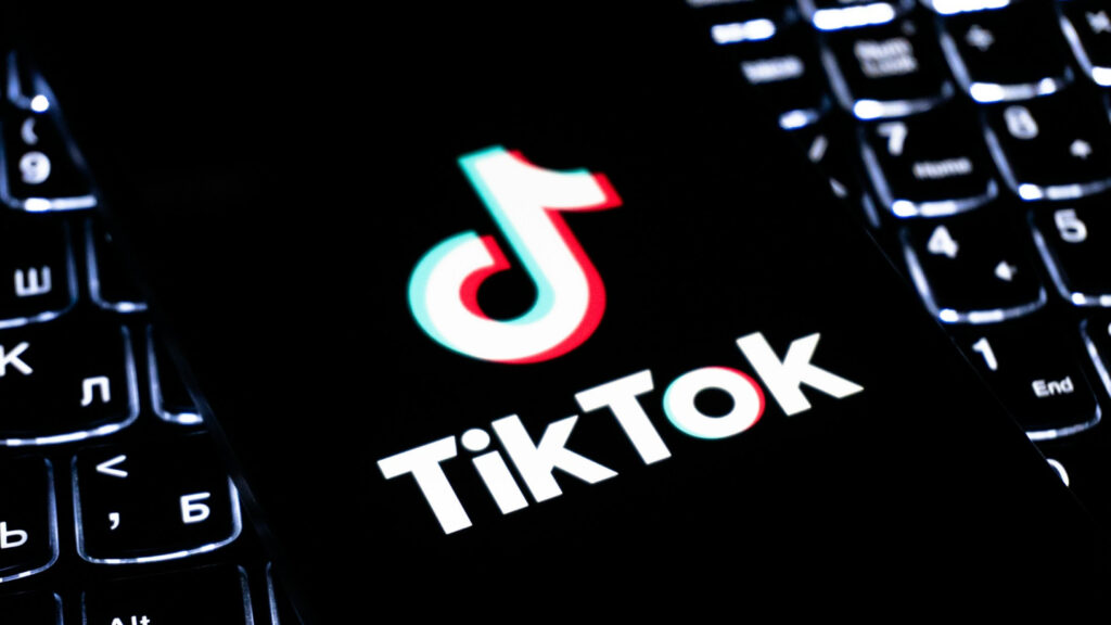 phone with TikTok app open on keyboard